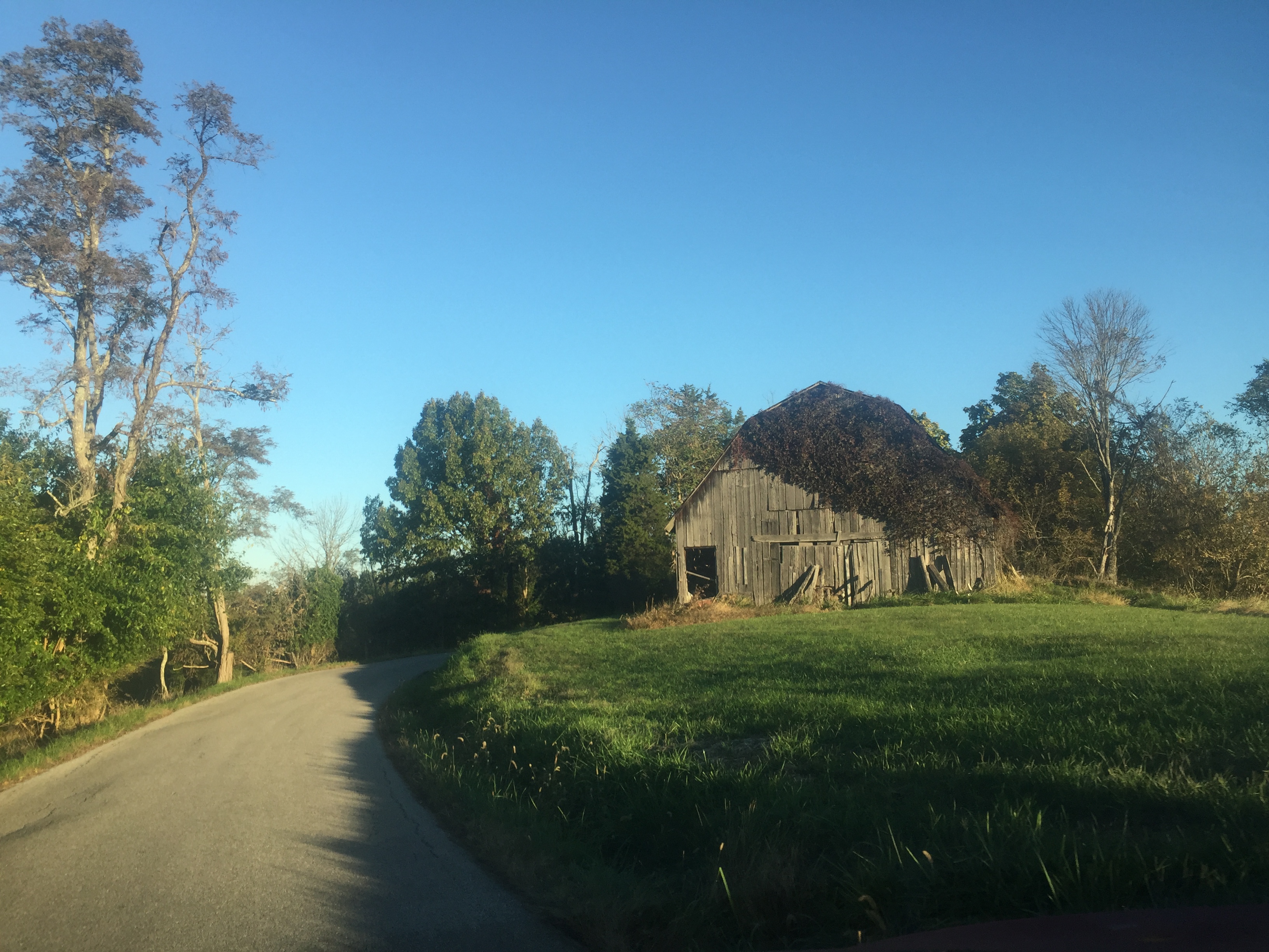 old barn along a road