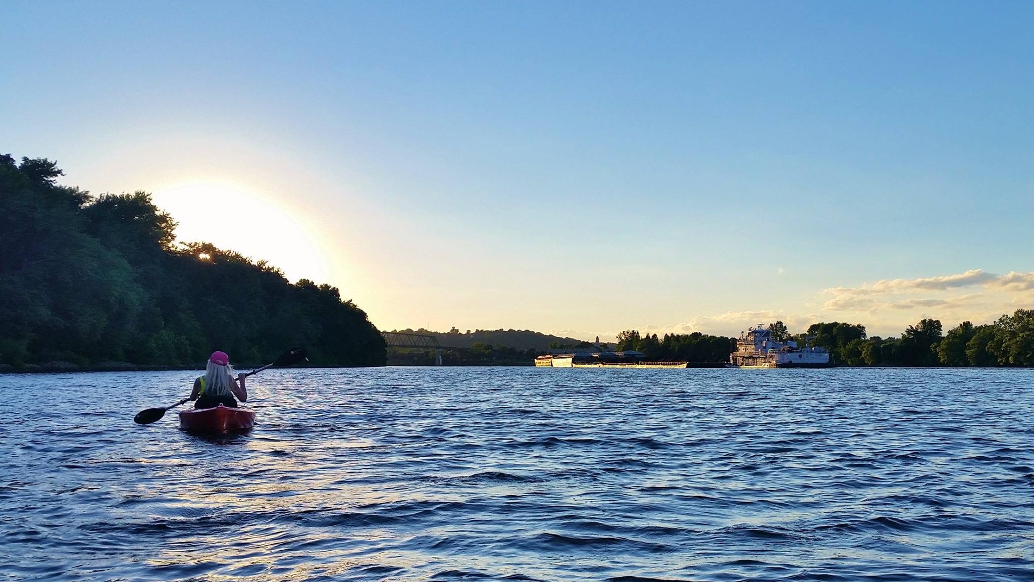 kayaking on a river during sunset