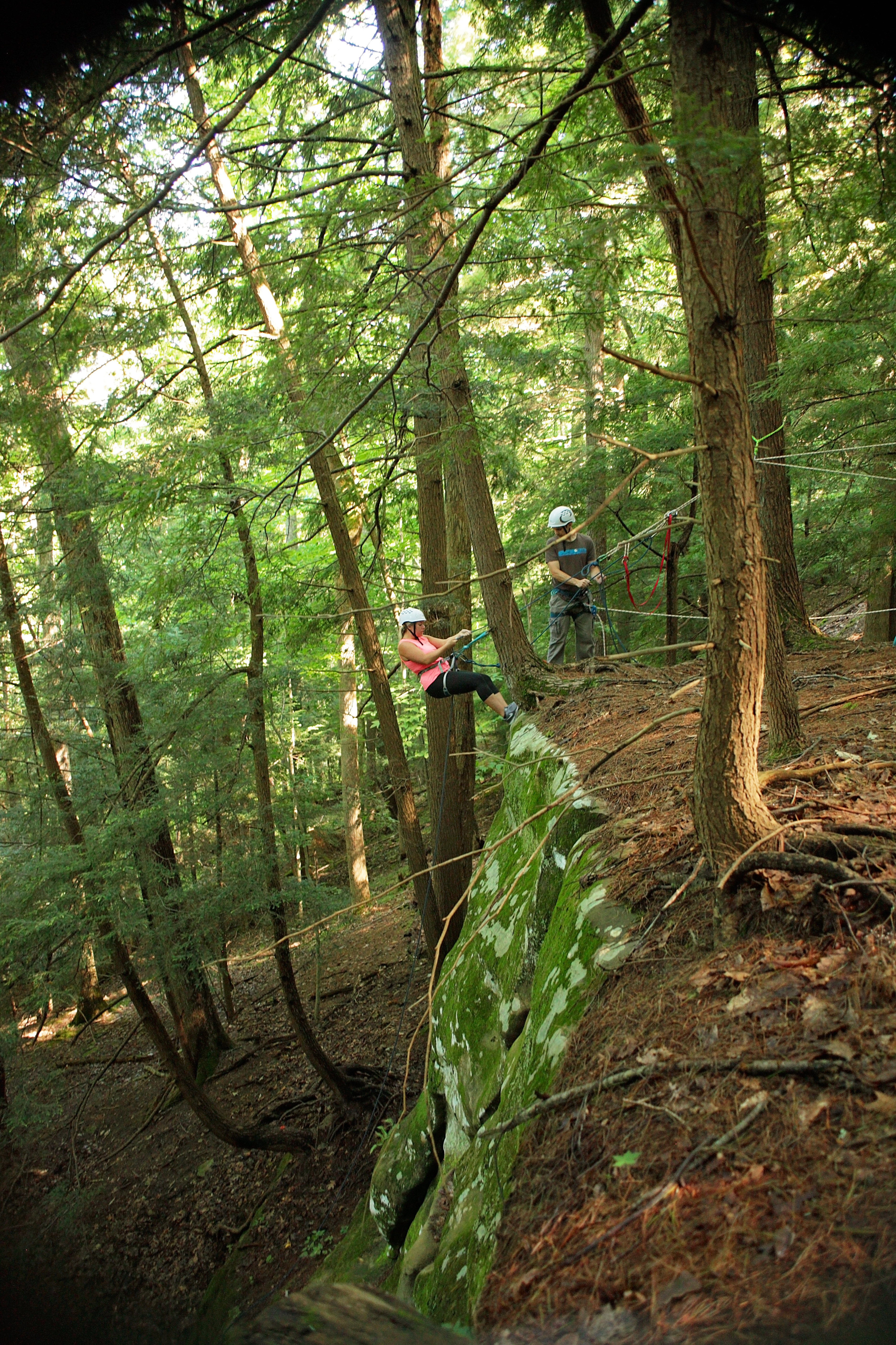 rappelling down a hill