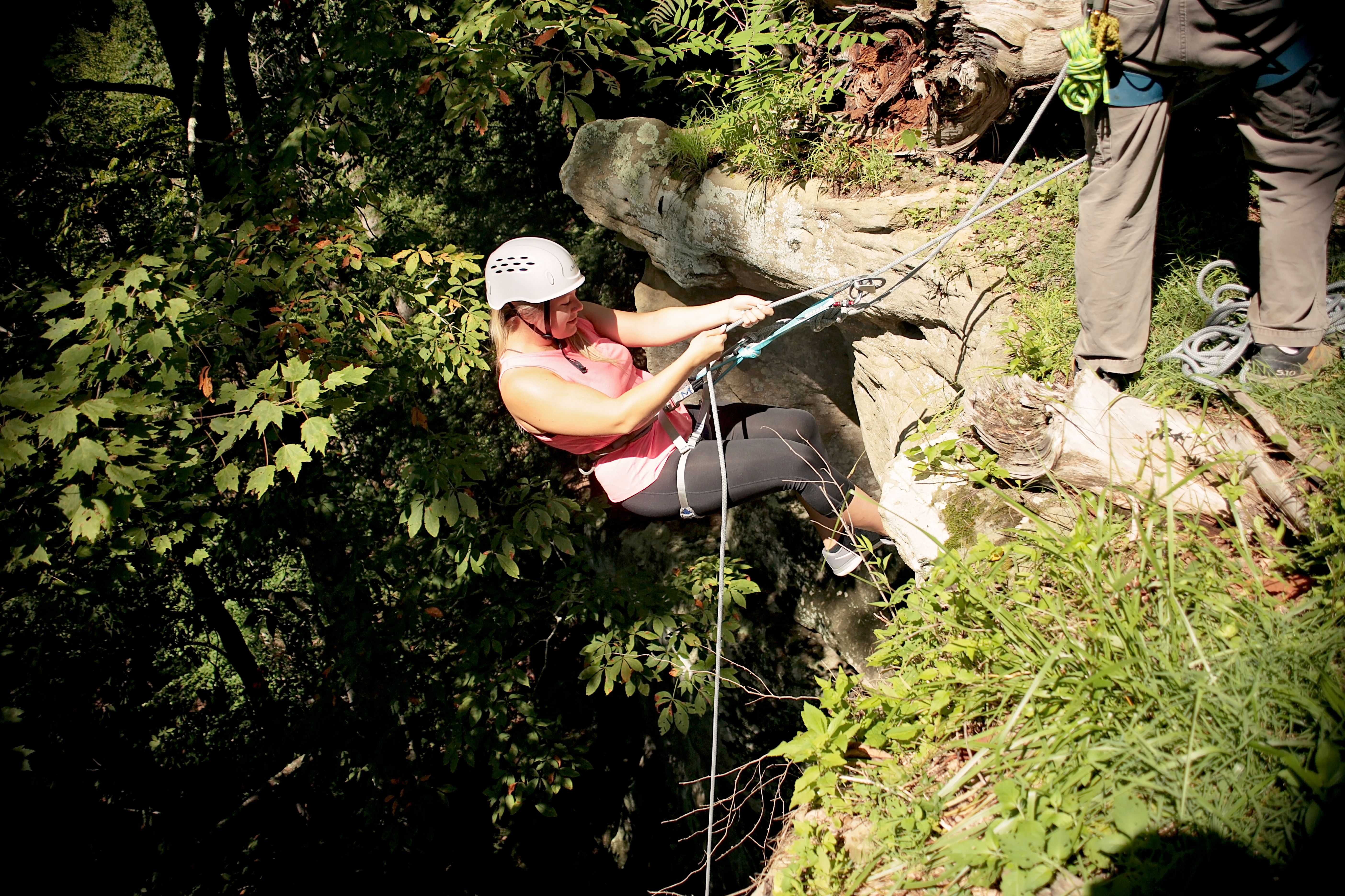 Rappelling  down a cliff