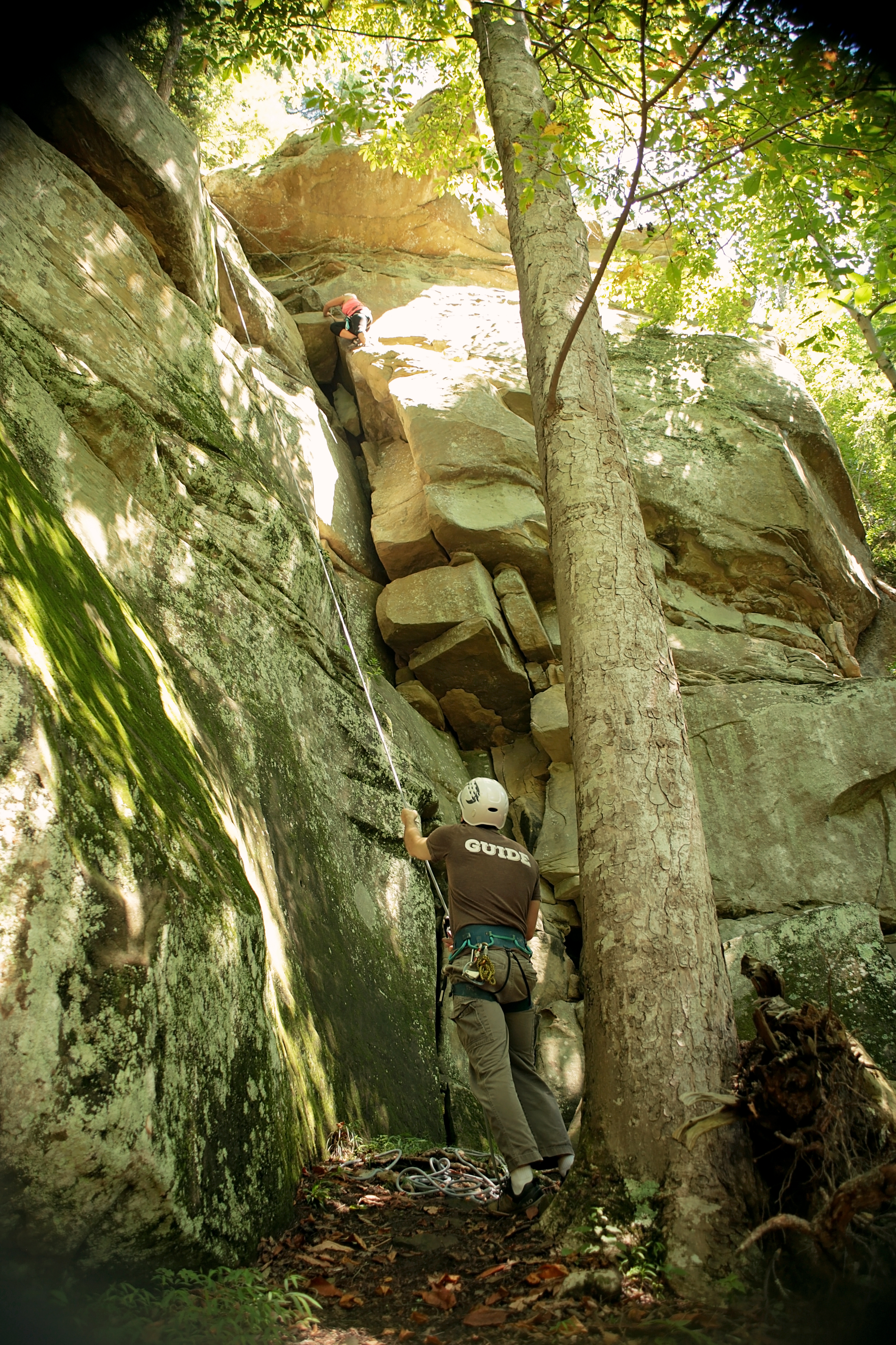 climbing a cliff with a belay