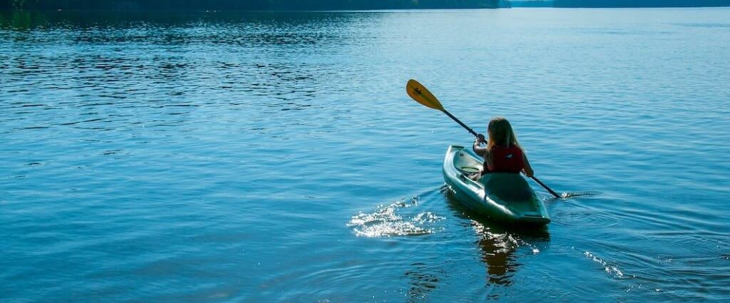 person paddling a kayak