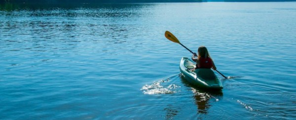 person paddling a kayak