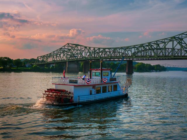 sternwheel boat on the river in late evening