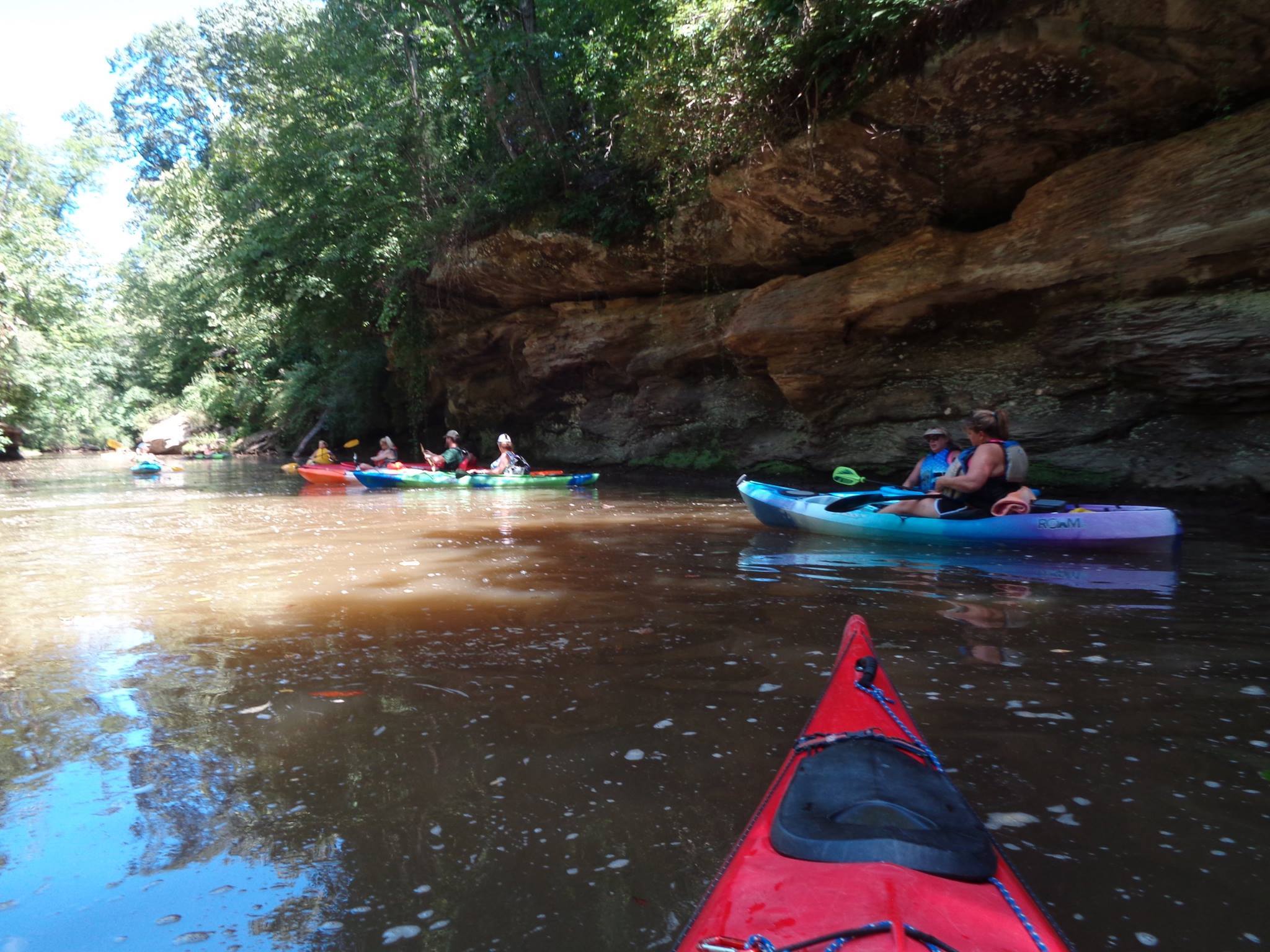 group kayaking on a river