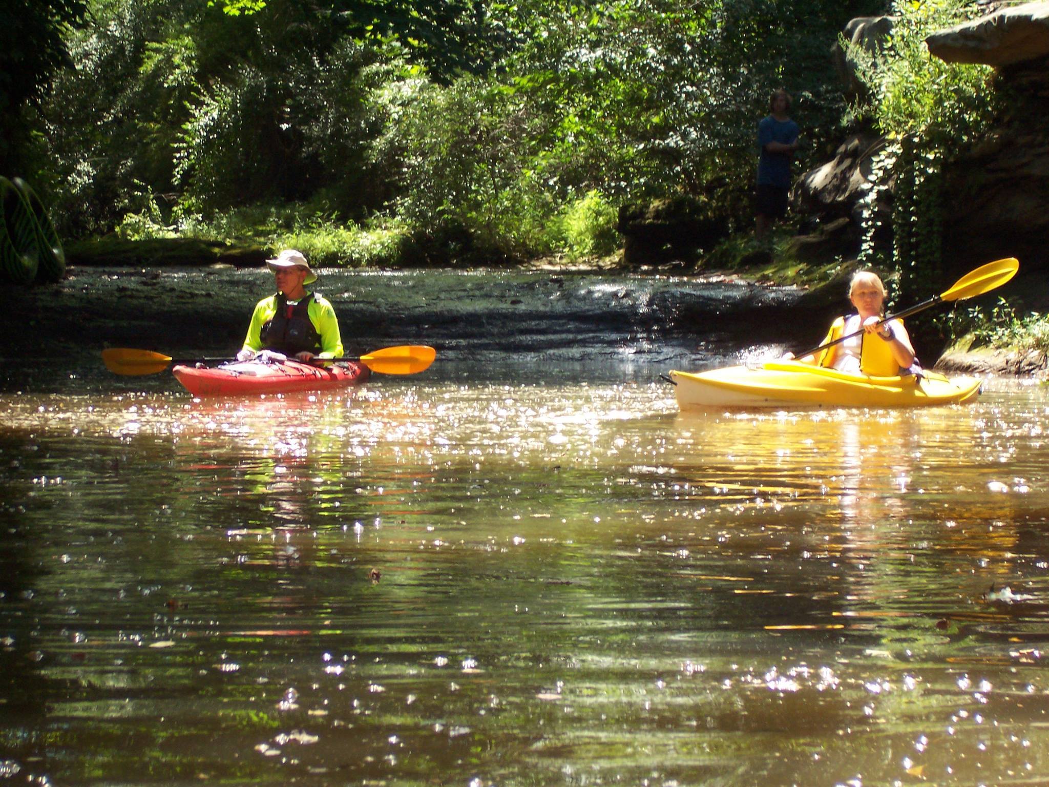 couople kayaking on a river