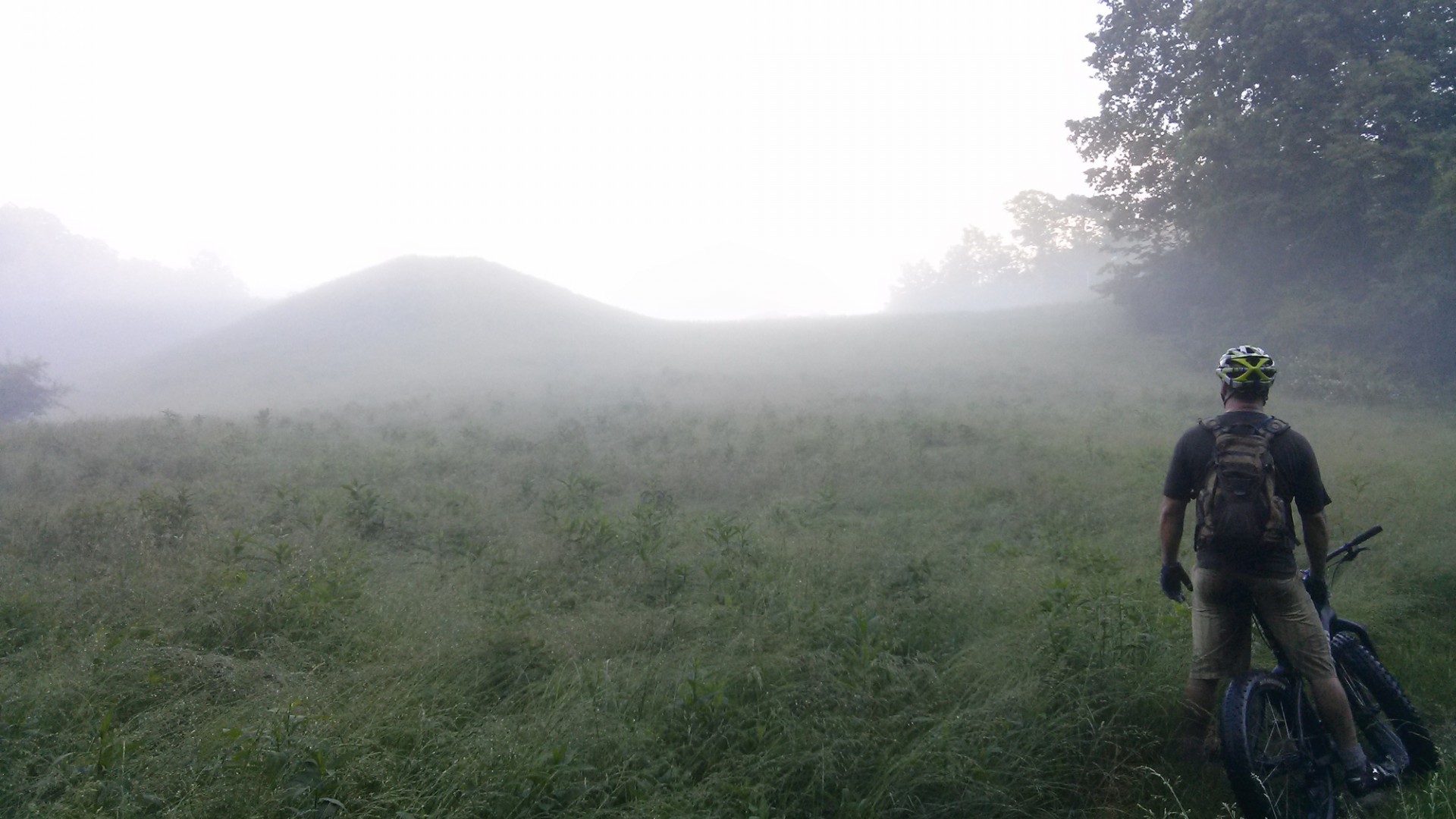 Biking outdoors in fog photo