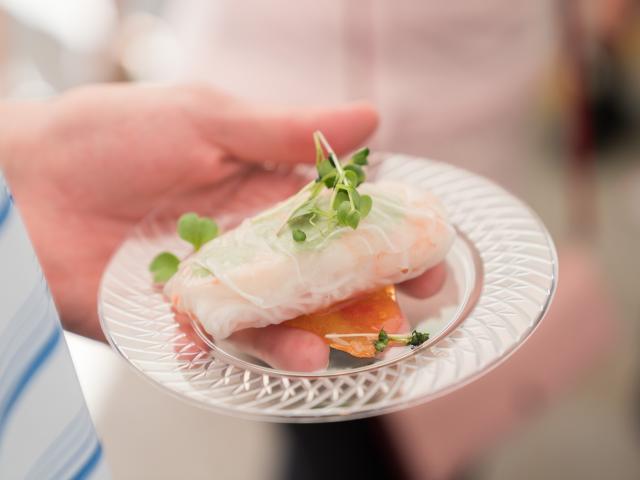 holding food on a plate