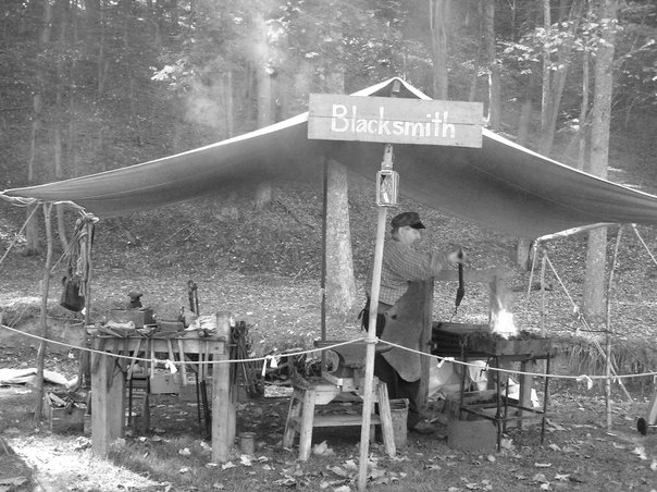 black and white image of a blacksmith