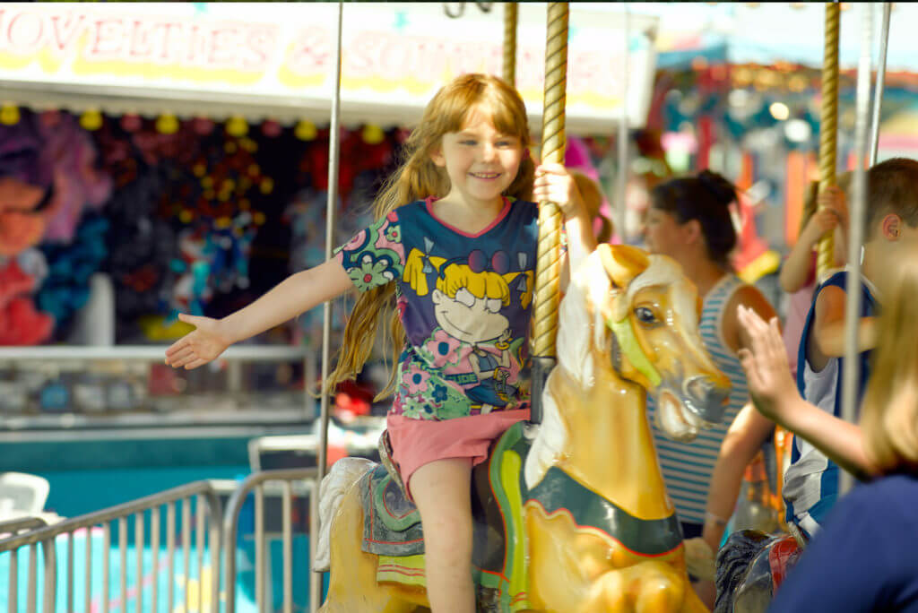 Kids riding merry-go-round at West Virginia Interstate Fair & Exposition