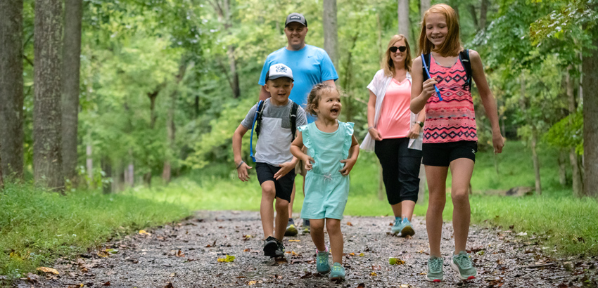 kids running on a hiking trail