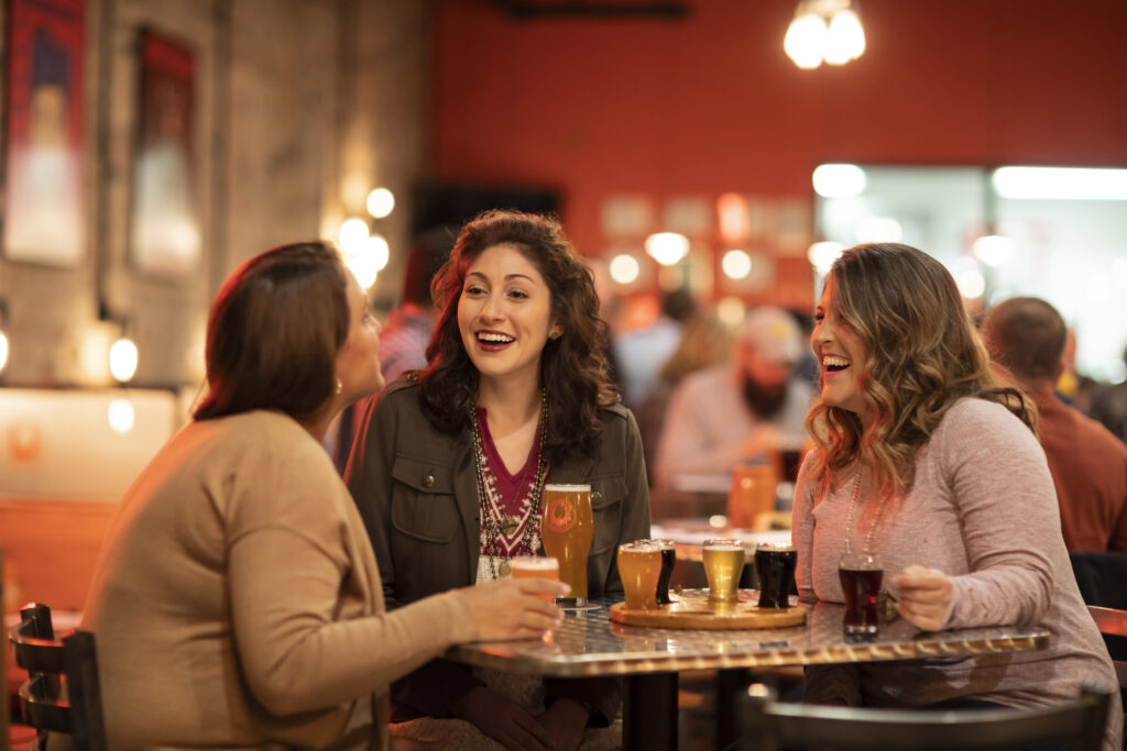 A group of friends dine in at Parkersburg Brewing Company.