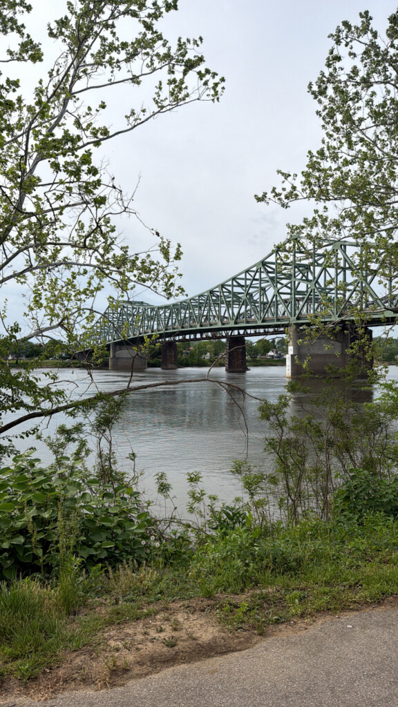 A scenic river view from the Parkersburg Ohio River Trail at Point Park. The 5th Street bridge is in the background.